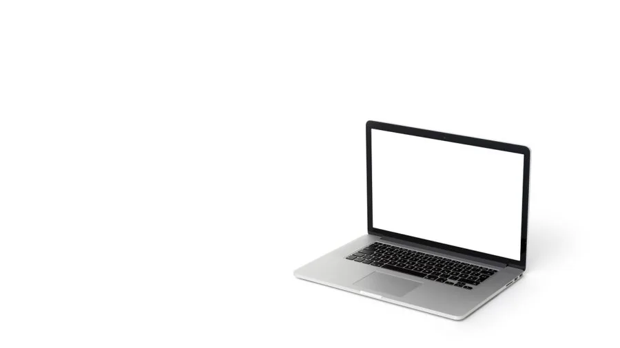 Person checking computer monitor displaying system information and performance metrics in home office setup