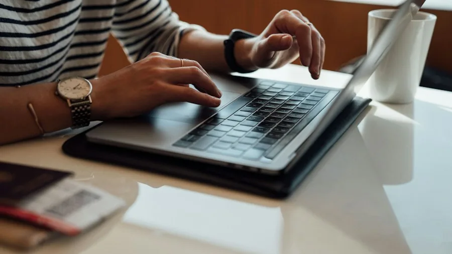 person checking device specifications on laptop
