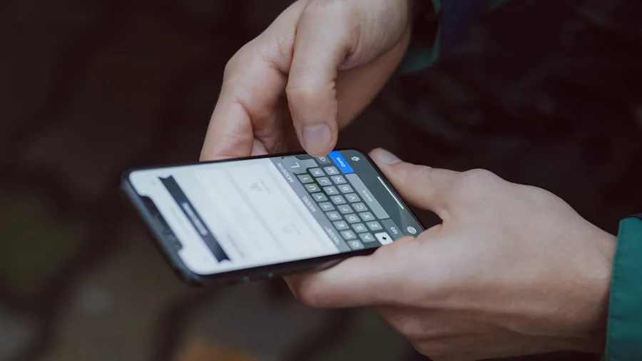 Person checking mobile app on smartphone in natural outdoor setting