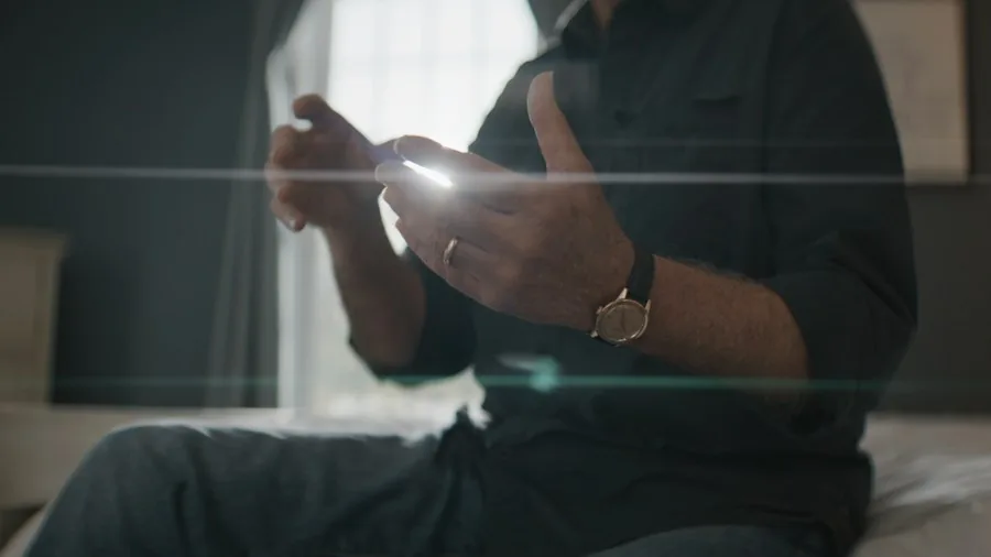 person checking phone safely indoors