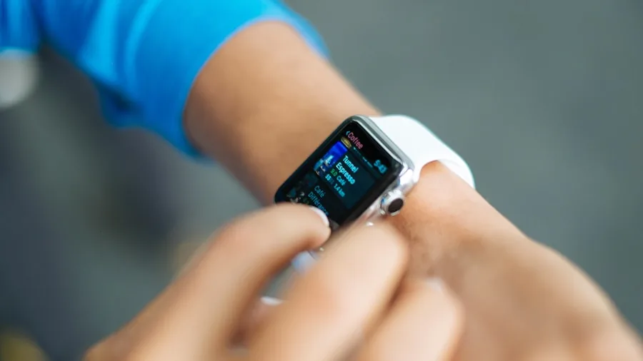 person checking smartwatch health metrics