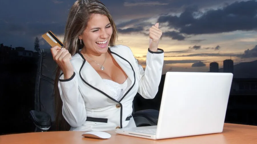 Person comparing options while planning a technology purchase with notebook and calculator