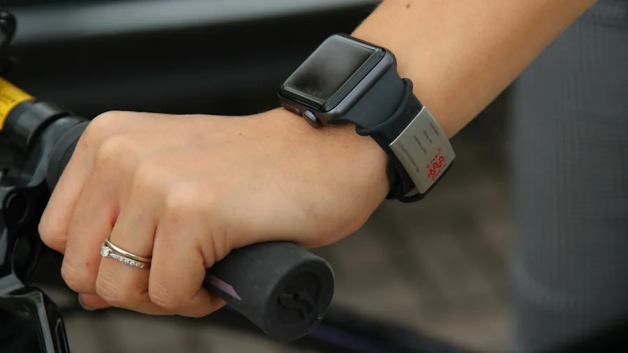 person cycling with smartwatch outdoors