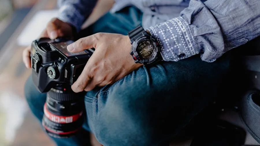 Person deciding between different camera types and systems for photography