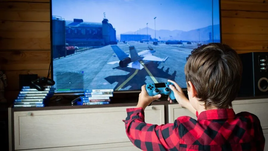 Person deeply engaged playing video game on console, demonstrating the immersive gaming experience of narrative-driven titles