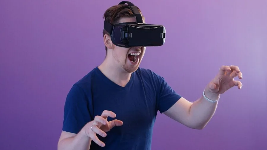 Person engaged in immersive virtual reality gaming experience with VR headset in home gaming setup