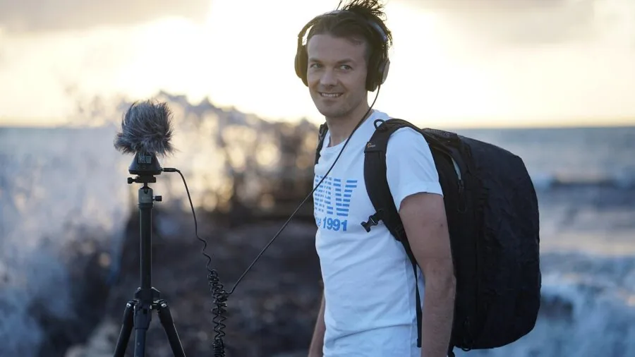 Person enjoying music with comfortable over-ear headphones during everyday activity
