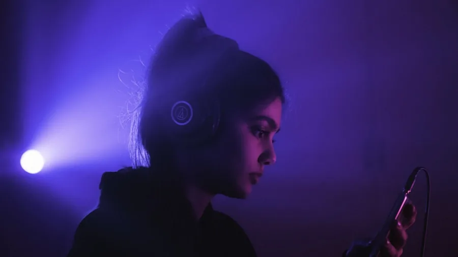 Person enjoying music with eyes closed, experiencing deep bass and sound quality in a relaxed lifestyle setting