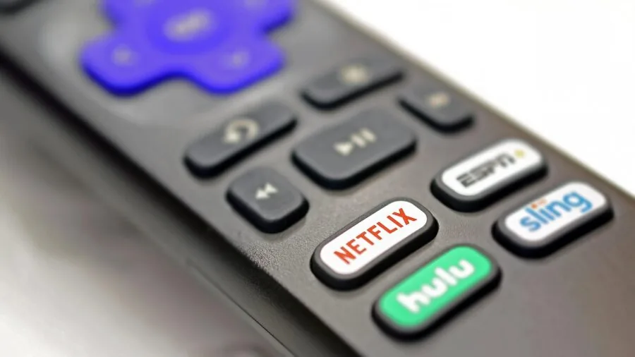 Person enjoying streaming video content on home entertainment system