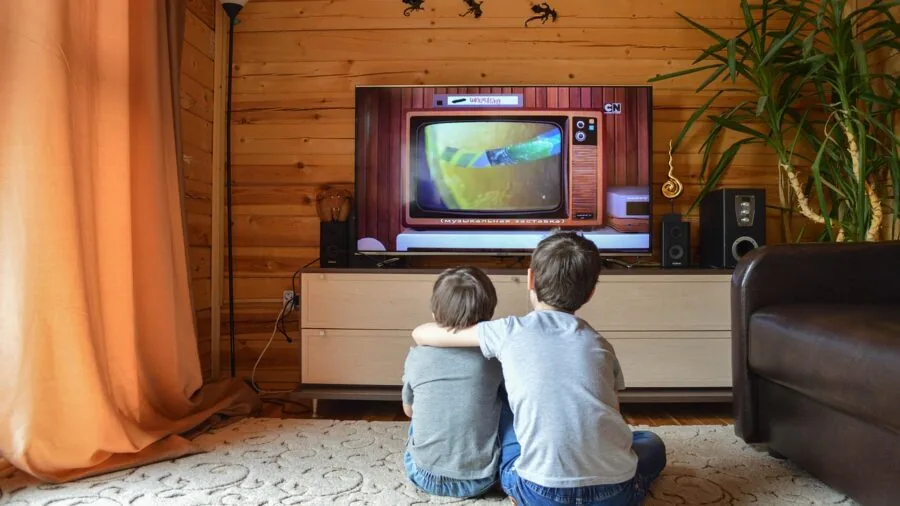 Person enjoying vibrant HDR content on large display TV in home entertainment setup