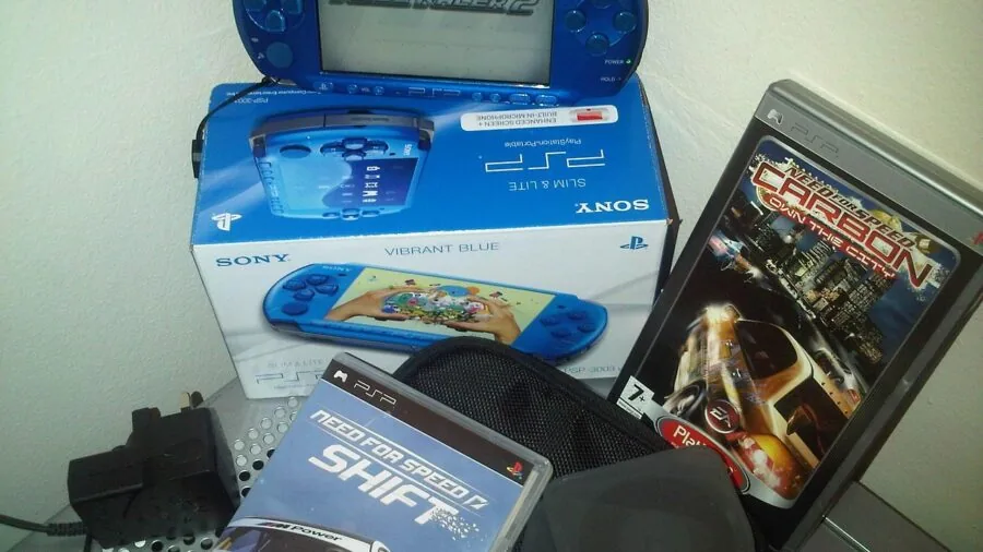 Person evaluating retro gaming consoles, comparing options and reading product information while making a purchasing decision