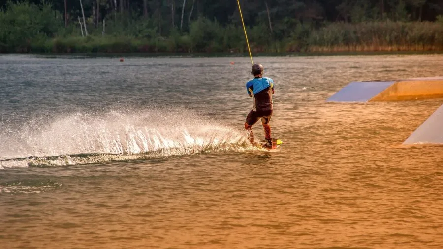Person filming extreme outdoor activity with camera equipment during adventure