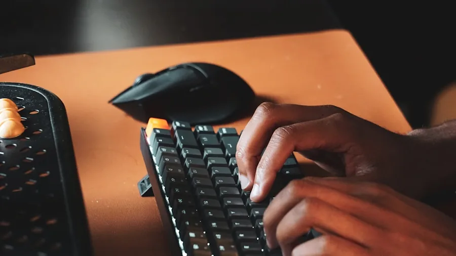 Person focused on typing at desk during work session, demonstrating typing comfort and concentration