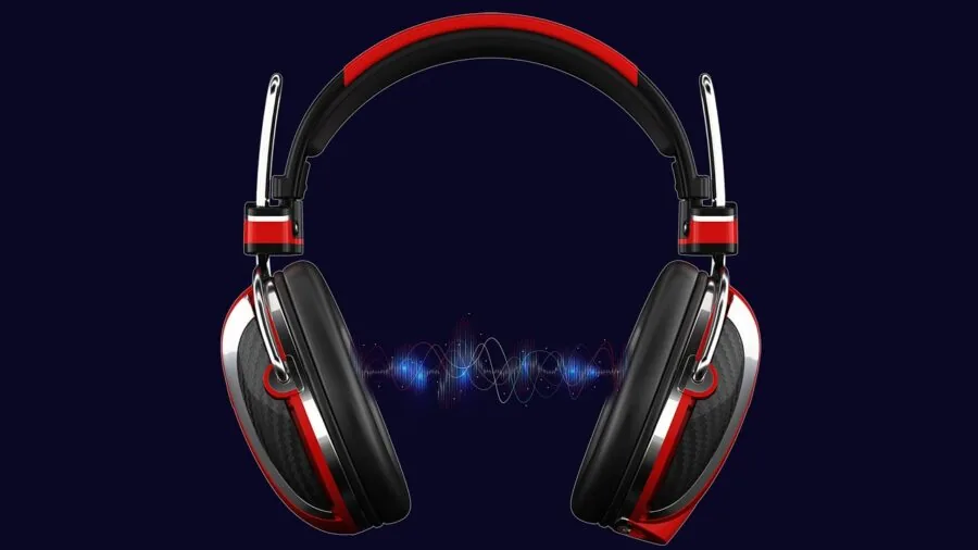 Person gaming at desk with multiple devices showing wireless headset compatibility across platforms