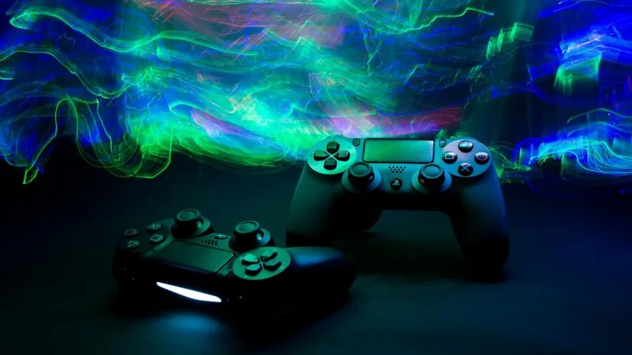 Person gaming on console with controller in modern living room setup