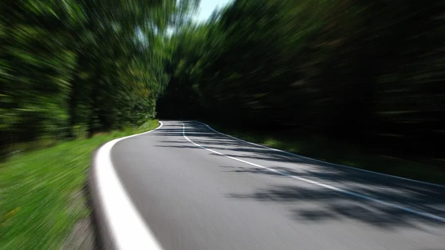 Person gaming on console with motion blur effect showing fast action gameplay
