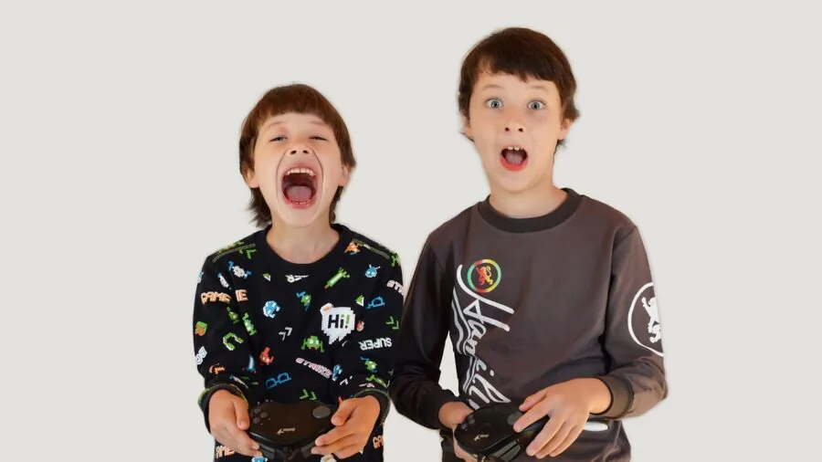 Person gaming on large projected display in living room with controller in hand