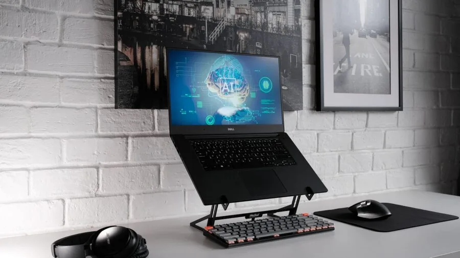 Person hands adjusting colorful keyboard switches at gaming desk workspace