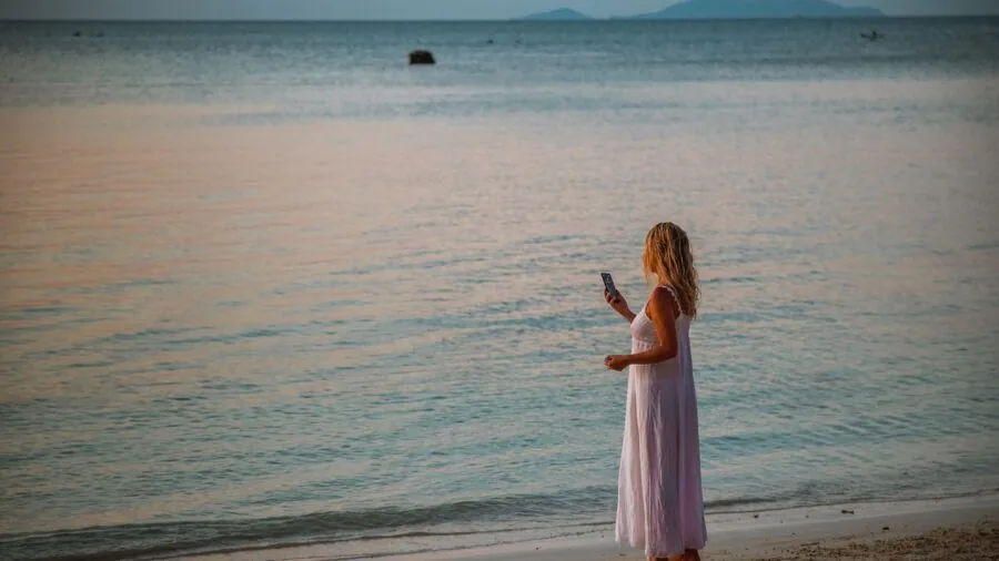 Person having a phone conversation in an outdoor environment with natural lighting