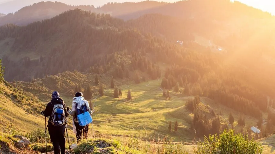Person hiking on a mountain trail during a long outdoor workout session