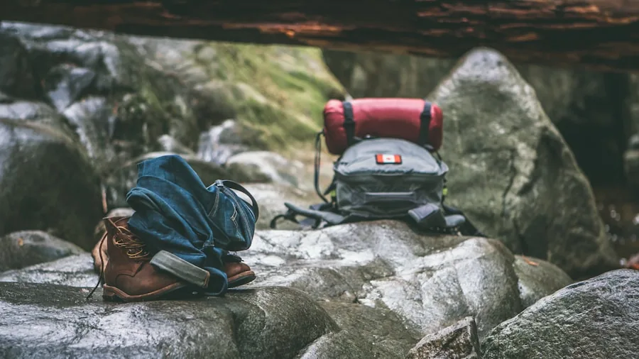 Person hiking with backpack enjoying music outdoors in nature