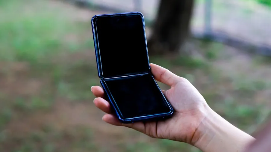 person holding folded smartphone