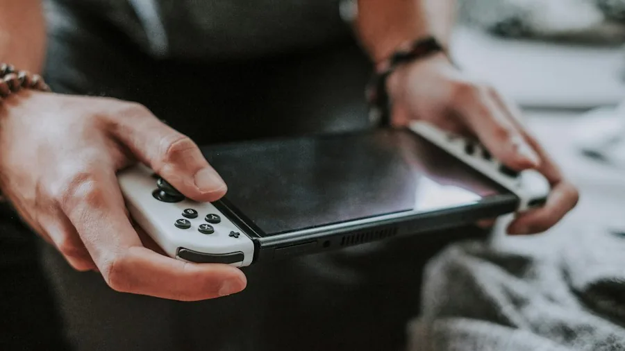 person holding game controller handheld