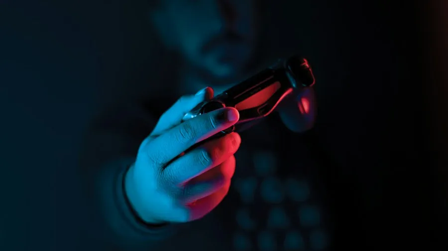 person holding modern gaming controller