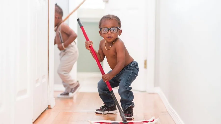 Person inspecting freshly mopped hardwood floor in modern living room