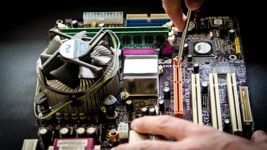 Person installing internal storage component into desktop computer tower
