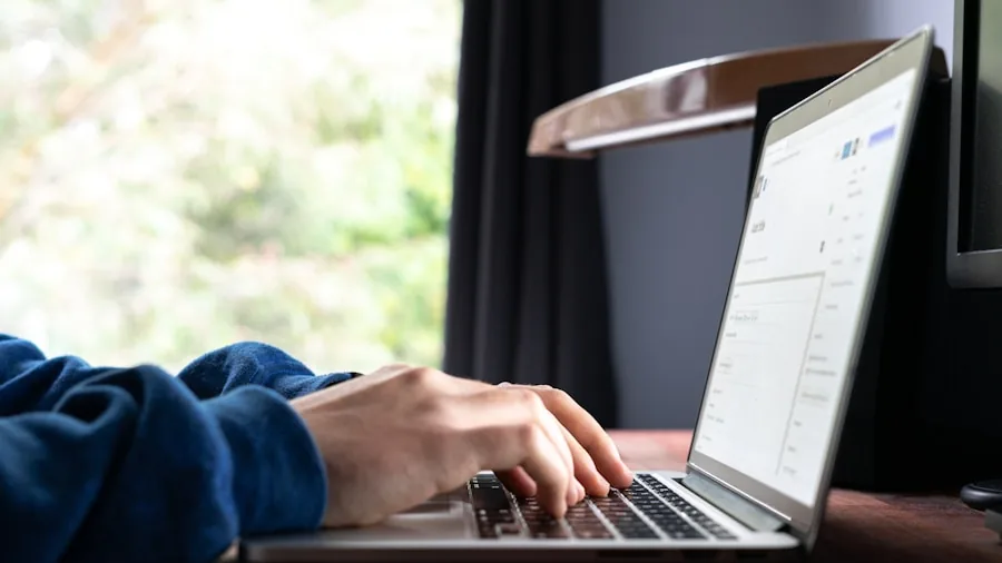 Person interacting with a responsive touchscreen laptop display in a real-world setting