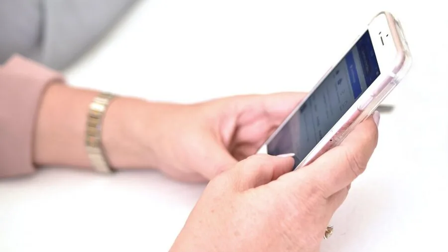 Person interacting with AI technology in everyday life, demonstrating smart assistant integration