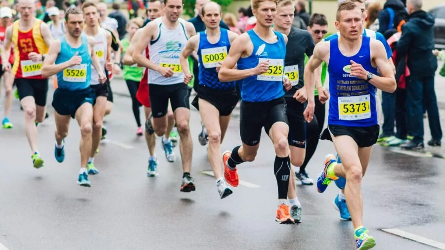 Person jogging outdoors during intense workout session with dynamic movement