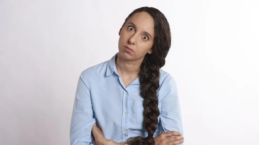 Person looking frustrated while using a slow digital interface on a device
