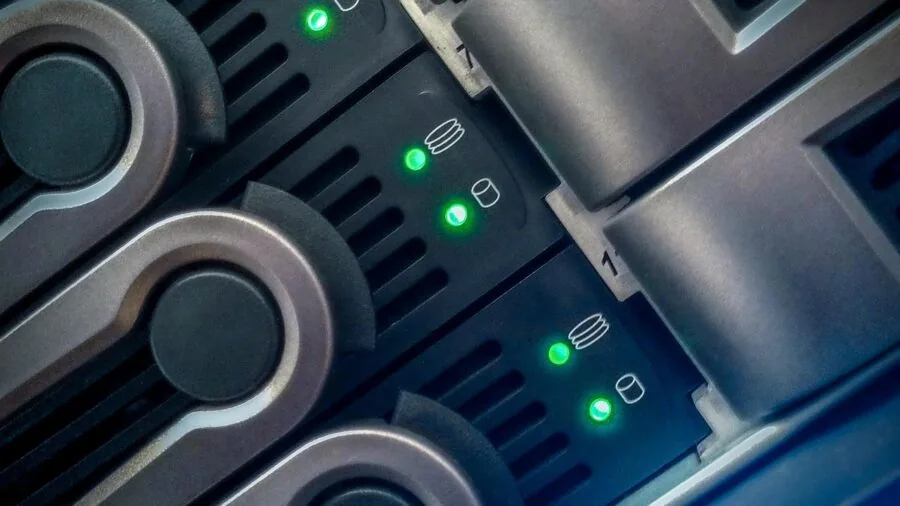 Person managing computer files and digital storage organization on desktop setup
