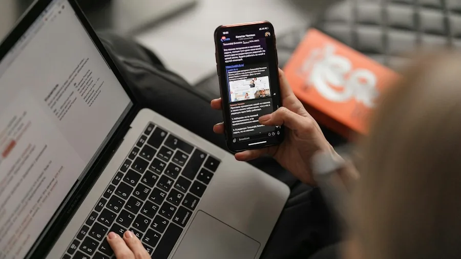 person multitasking on large screen phone