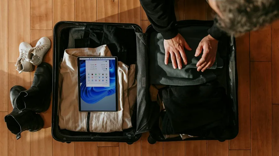 person packing game console travel