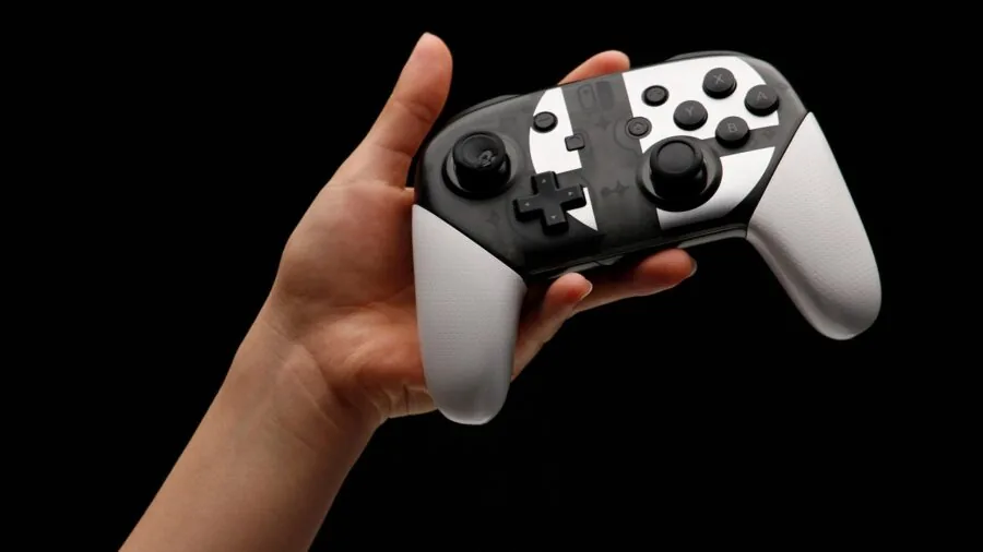 Person plugging in wireless game controller to charge battery during gaming session