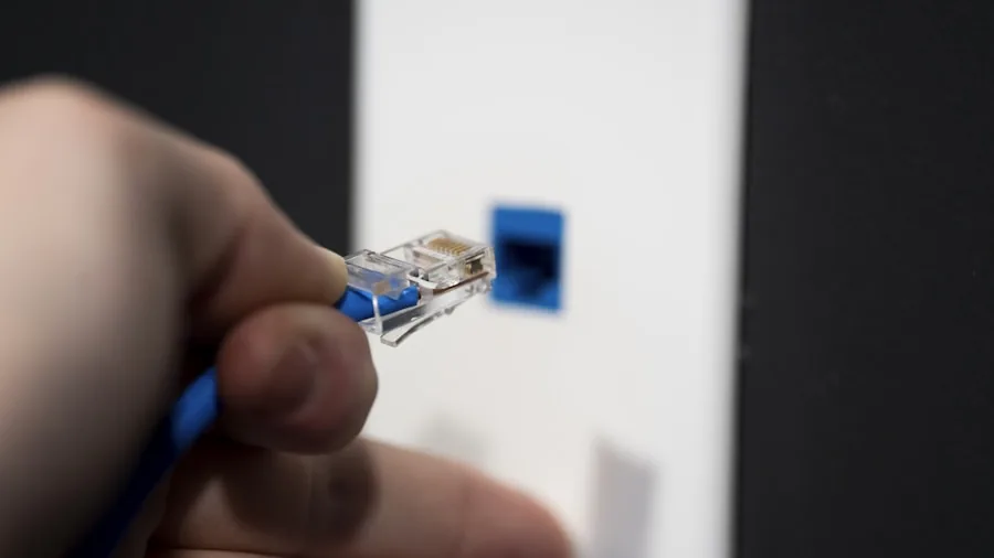 Person plugging USB cable into laptop, demonstrating data connection and transfer technology setup