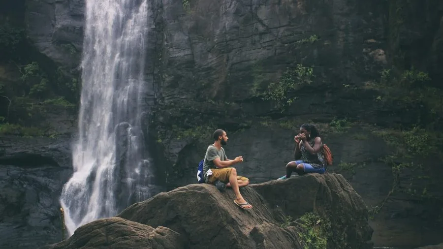 Person recording video content during outdoor activities with camera equipment during daytime
