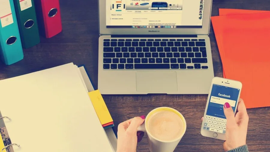 Person reviewing and sharing digital photos on mobile device with wireless connectivity