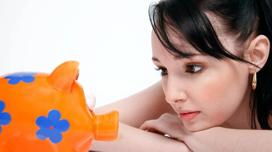 Person reviewing financial documents and making cost-benefit analysis decisions for tech purchases