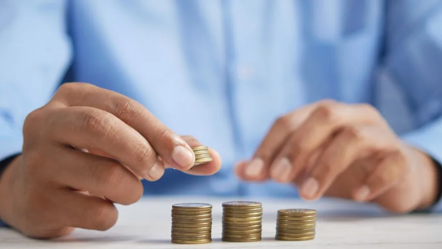 Person reviewing financial options and making thoughtful purchasing decisions at a desk