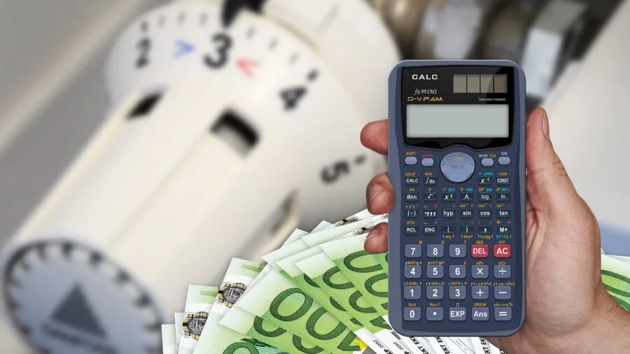 Person reviewing gaming expenses and budget costs on paper