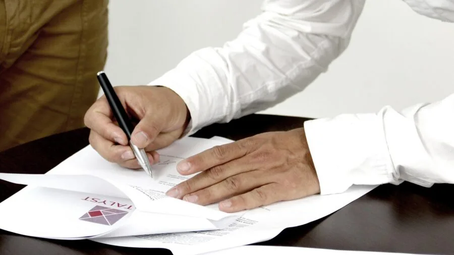 Person reviewing important document with confidence and trust in natural lighting
