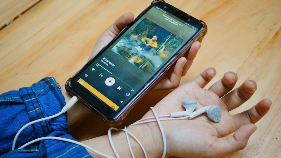 person running with phone music app