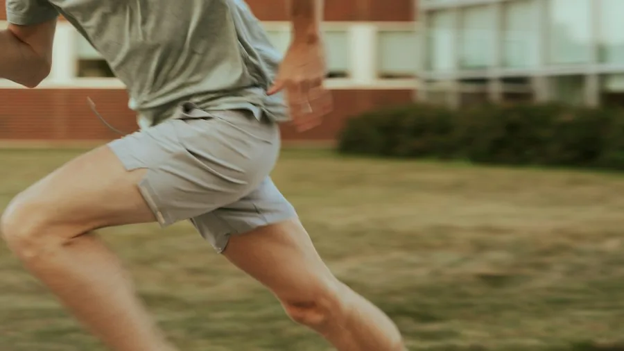 person running with smartwatch