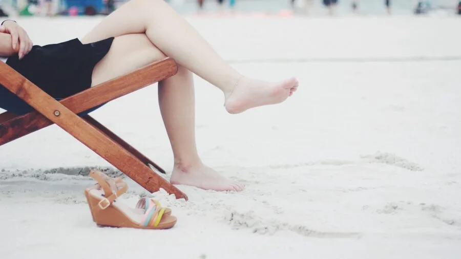 Person sitting in sturdy chair demonstrating proper weight support and frame construction