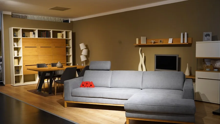 Person sitting on couch viewing television from comfortable distance in modern living room