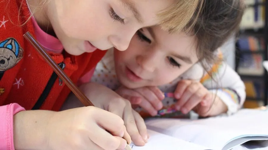 Person sketching on digital tablet with focused attention to hand stability and pressure control